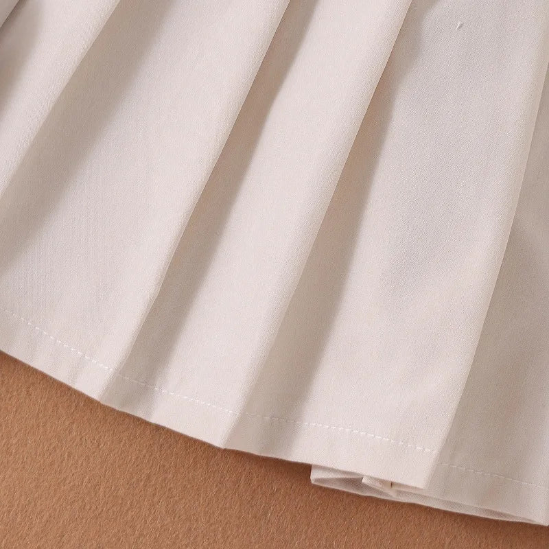 Sleeveless Button Vest and Pleated Skirt Outfit