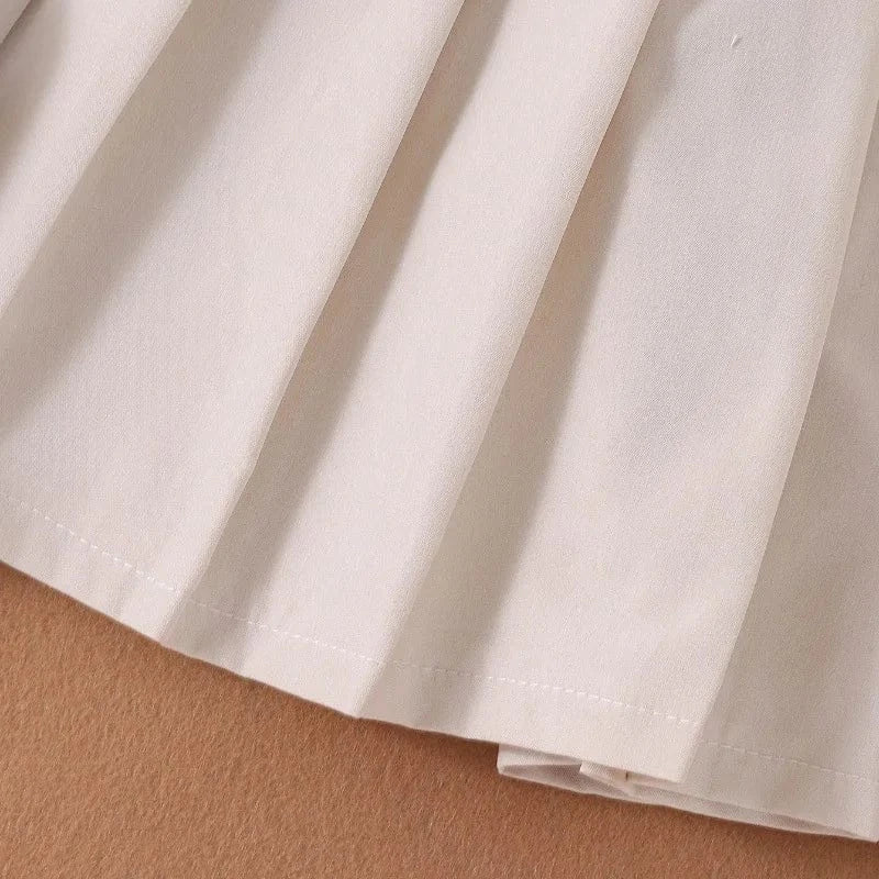 Sleeveless Button Vest and Pleated Skirt Outfit