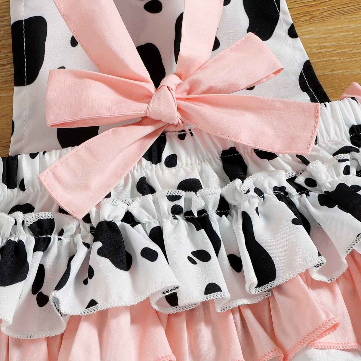 Cow print baby romper