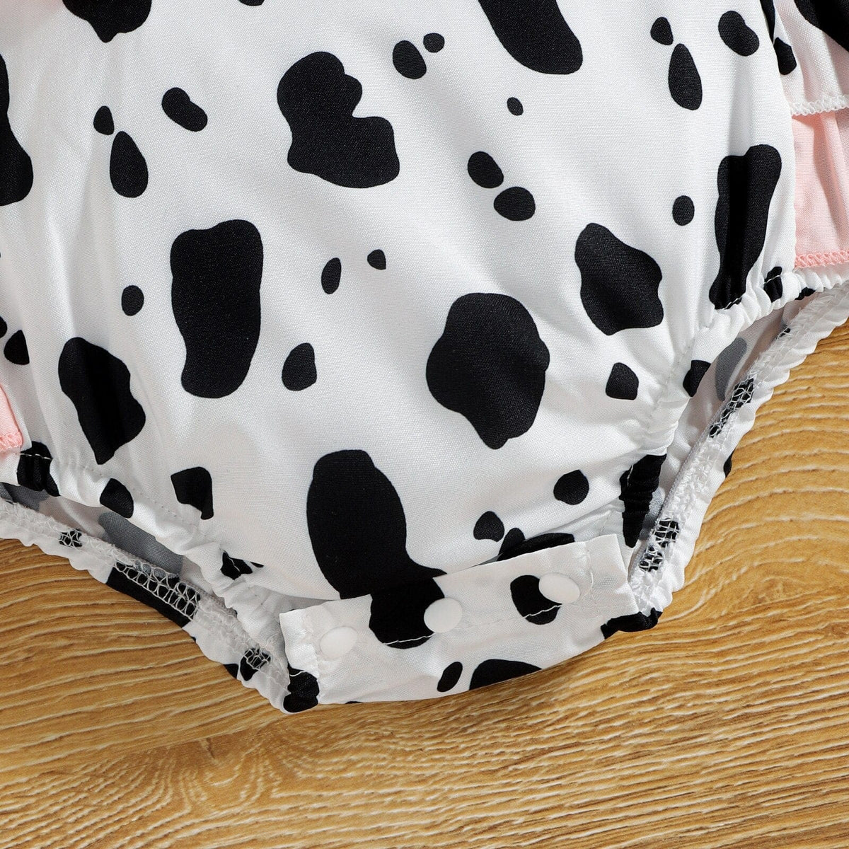 Cow print baby romper